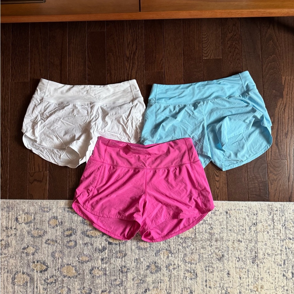 Lot of 3 Lululemon Shorts Sz 8 - White, Blue, and Pink